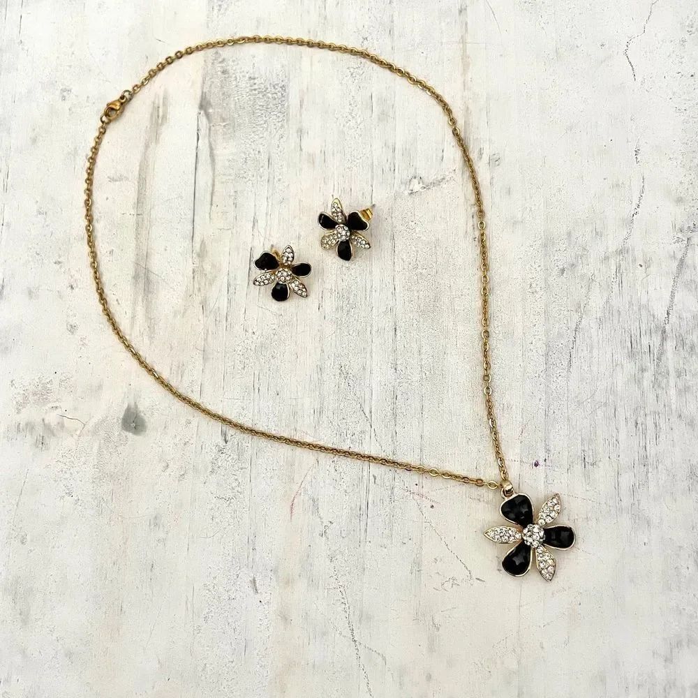Black floral rhinestone necklace and earrings